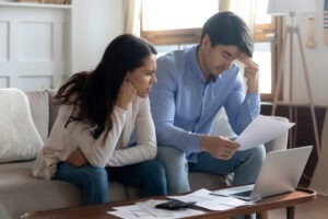 Sitting couple wonders what signs of hedge fund fraud are.