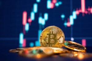 Bitcoin with a chart in the background, with someone nearby wondering if they can recover against Kraken for stolen crypto
